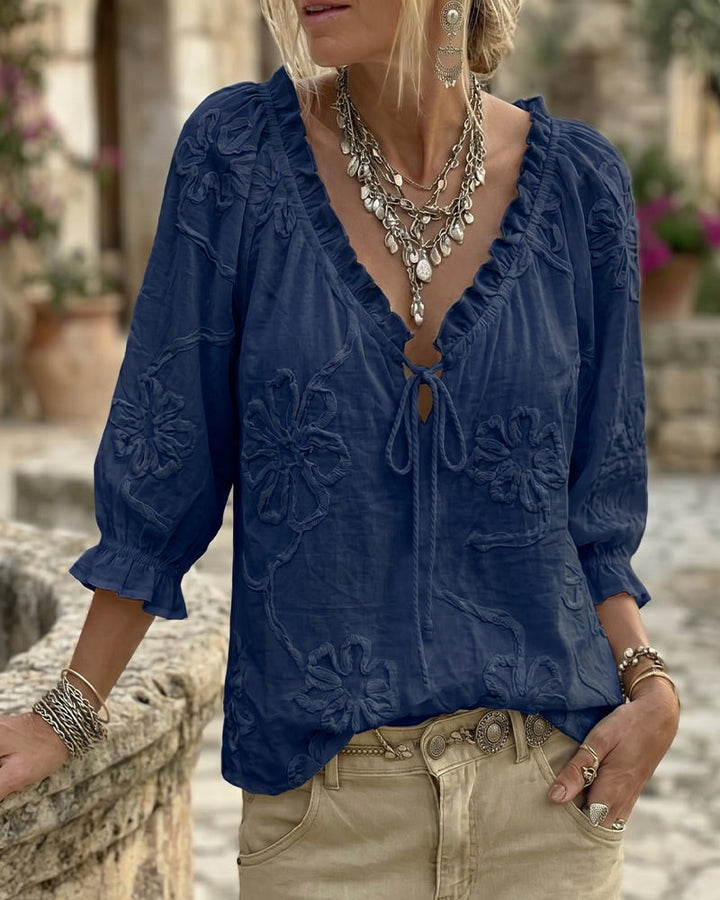 Blusa de algodón 100%, escote en V envolvente, con lazo y volantes