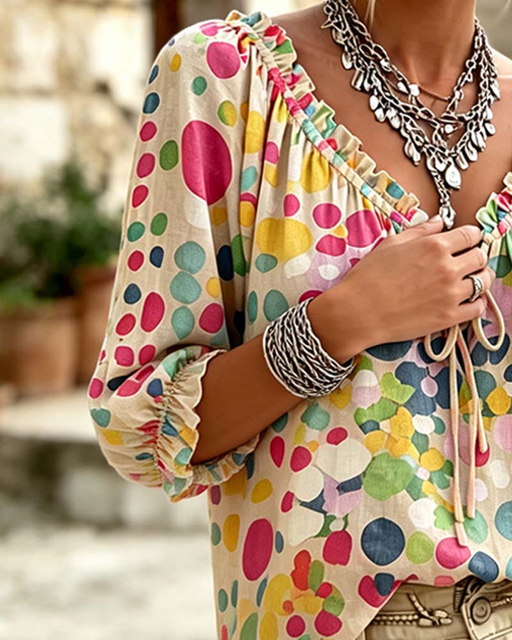 Blusa de escote en V con lunares y lazos