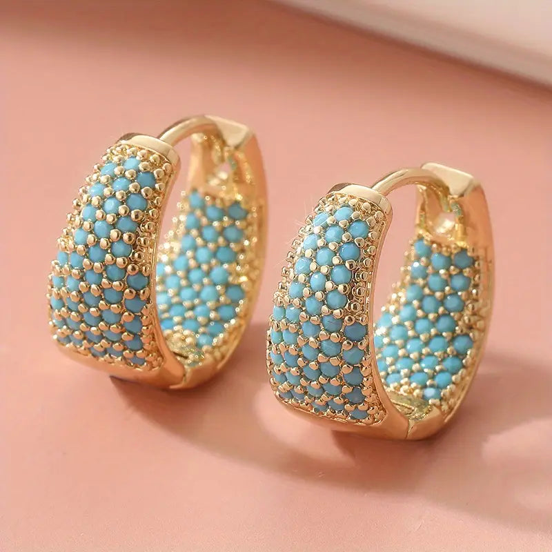 Elegantes aros de oro con perlas turquesas