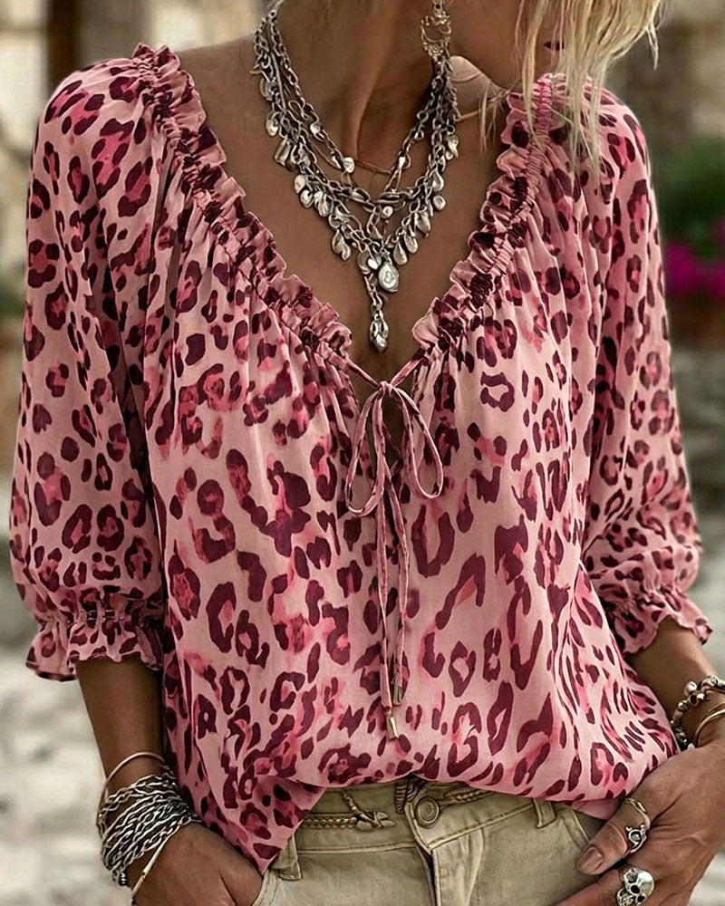 Blusa estampada de leopardo cuello en V mangas abullonadas con lazos