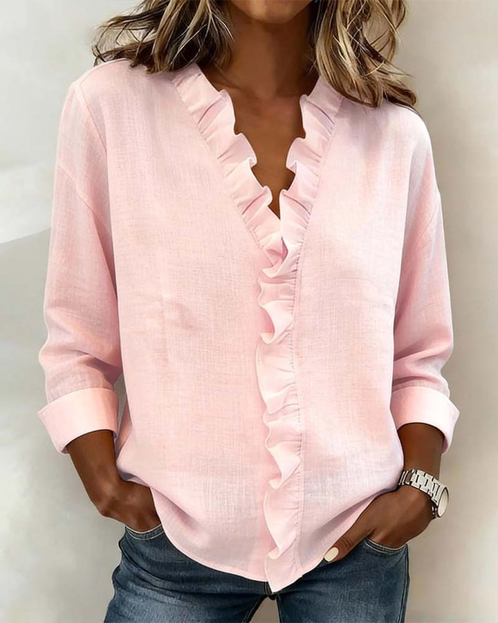 Blusa de manga larga con volantes y escote en V
