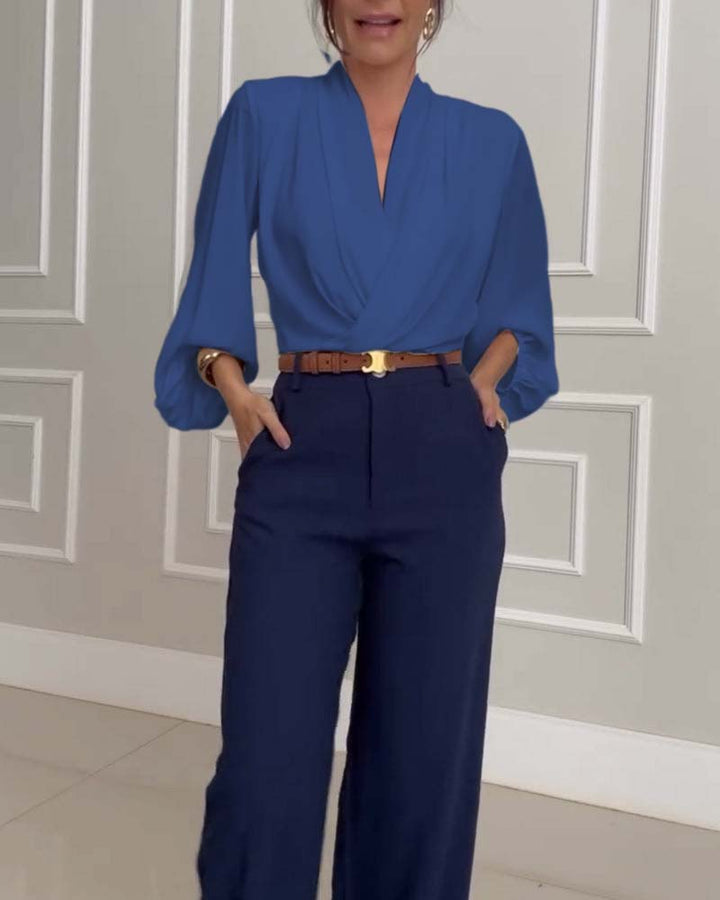 Blusa de moda con mangas farol y escote en V de color sólido