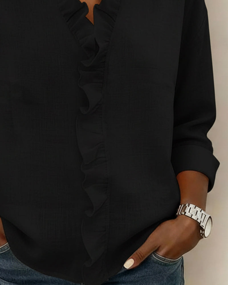 Blusa de manga larga con volantes y escote en V