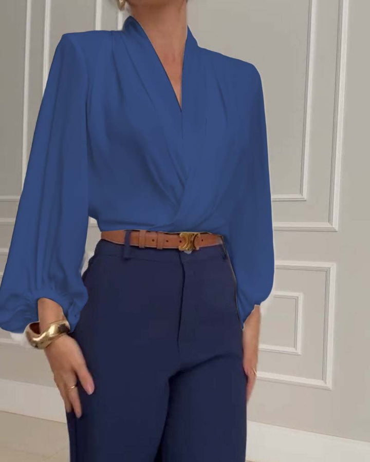 Blusa de moda con mangas farol y escote en V de color sólido