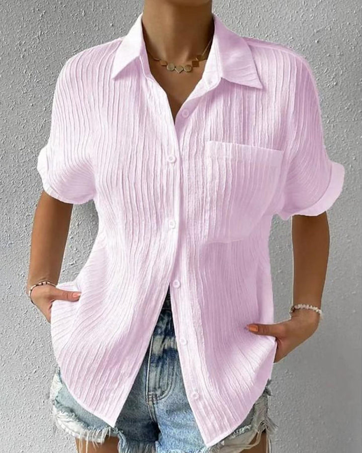 Blusa de manga corta cómoda con cuello de solapa y bolsillo liso