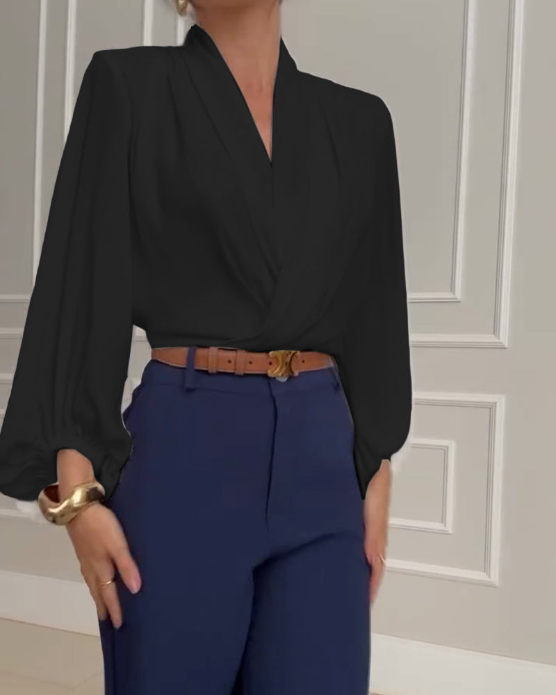 Blusa de moda con mangas farol y escote en V de color sólido