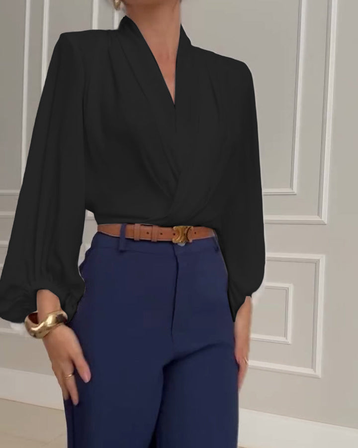Blusa de moda con mangas farol y escote en V de color sólido