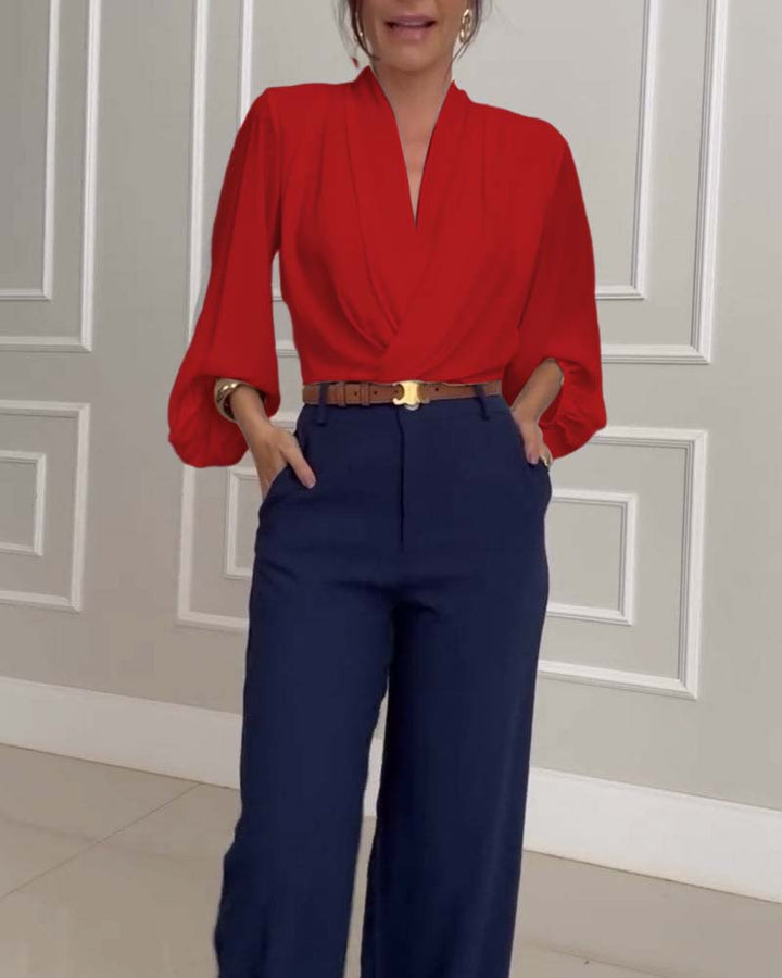 Blusa de moda con mangas farol y escote en V de color sólido