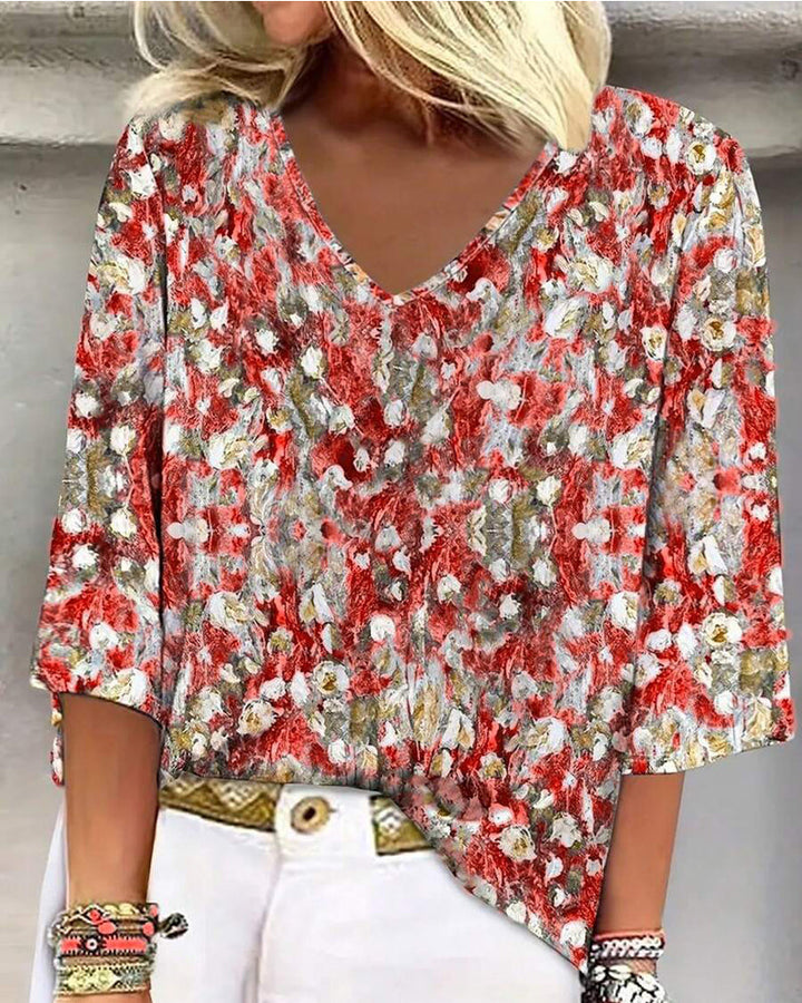 Blusa estampada floral escote en V manga tres cuartos