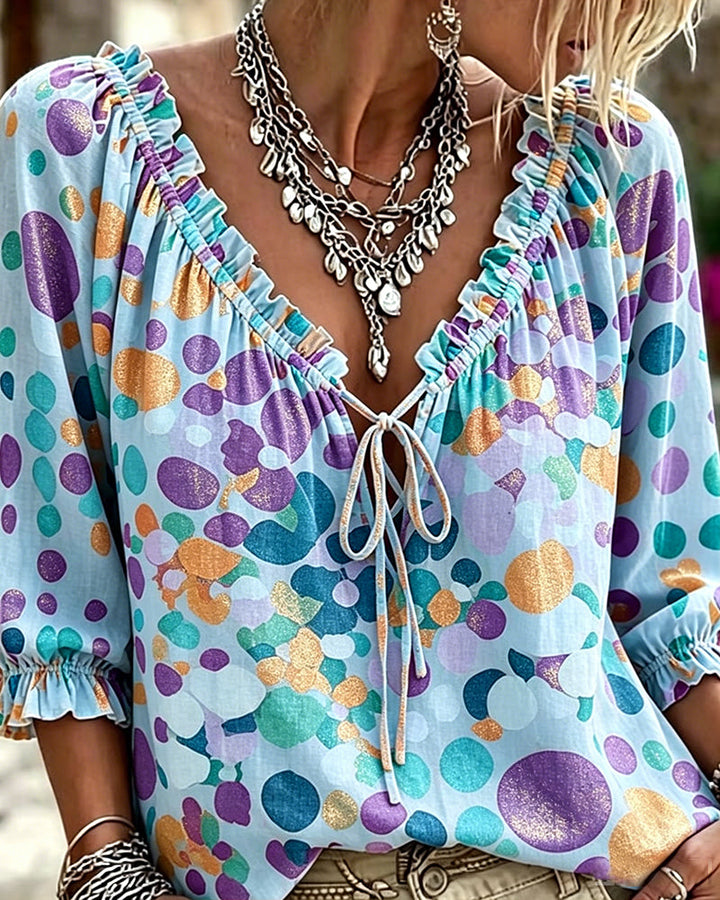 Blusa de escote en V con lunares y lazos