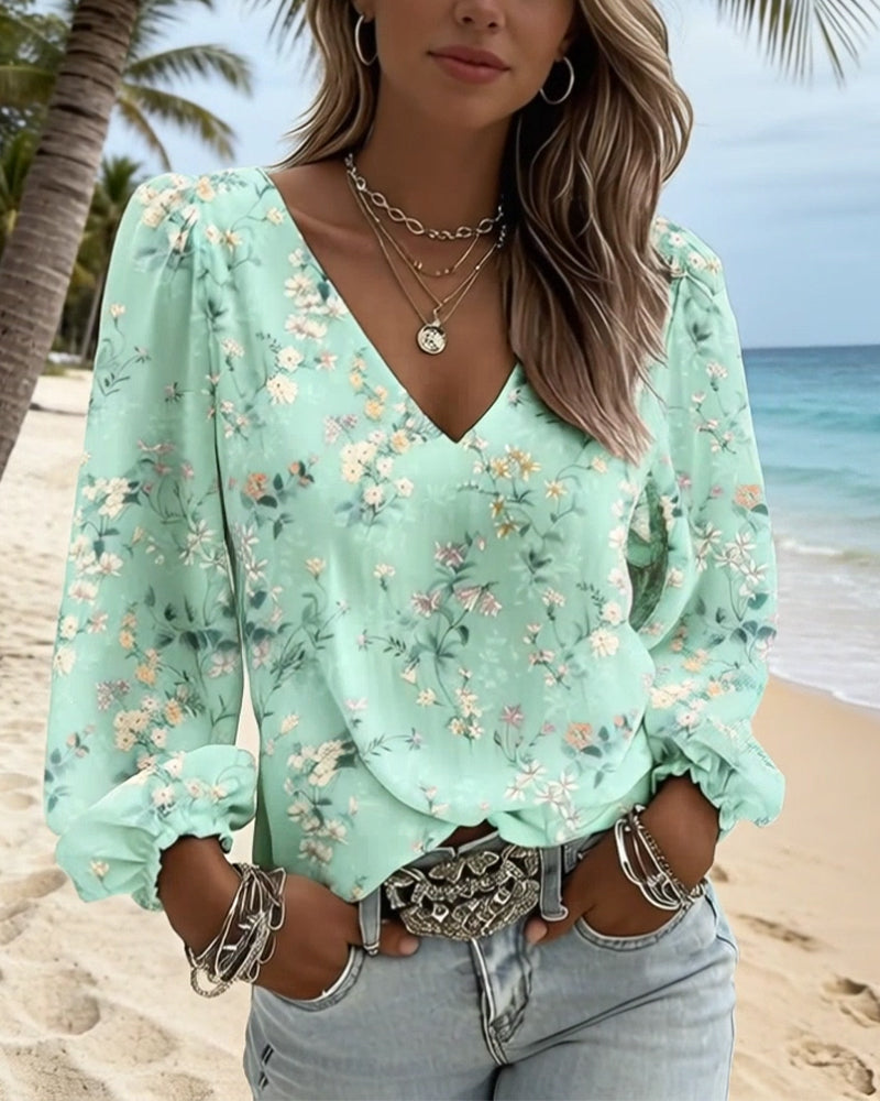 Blusa floral con cuello en V y mangas abullonadas