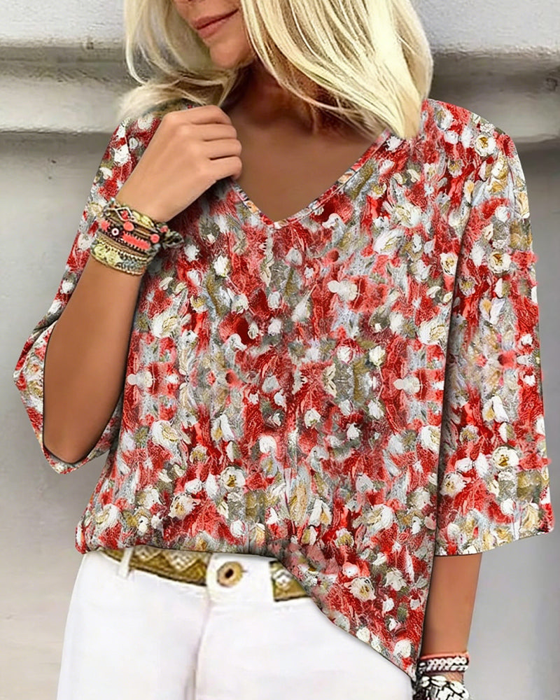 Blusa estampada floral escote en V manga tres cuartos