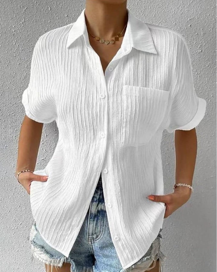 Blusa de manga corta cómoda con cuello de solapa y bolsillo liso