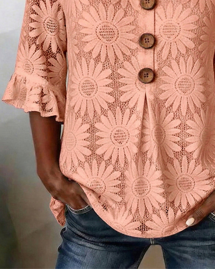 Blusa con estampado de margaritas y mangas con volantes