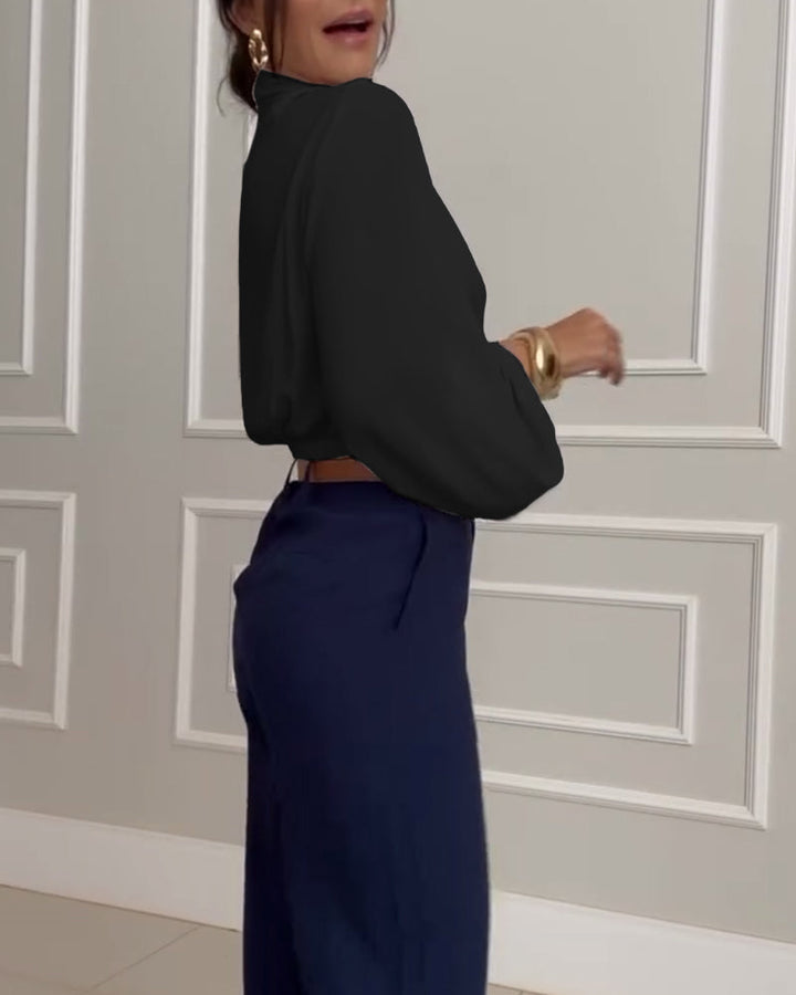 Blusa de moda con mangas farol y escote en V de color sólido