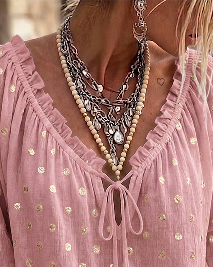 Blusa con escote en V y mangas acampanadas