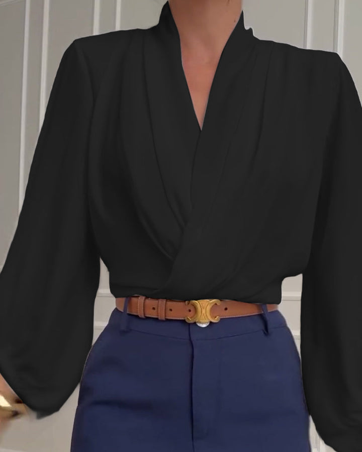 Blusa de moda con mangas farol y escote en V de color sólido