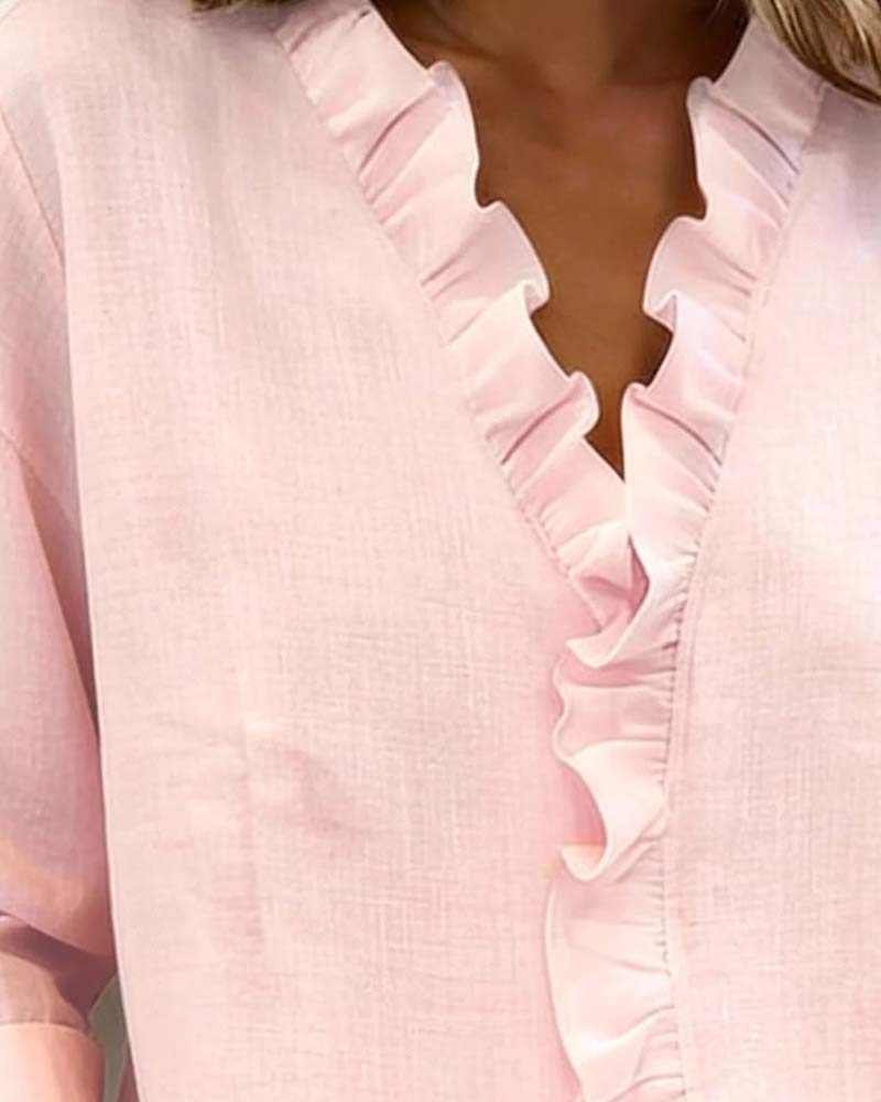 Blusa de manga larga con volantes y escote en V