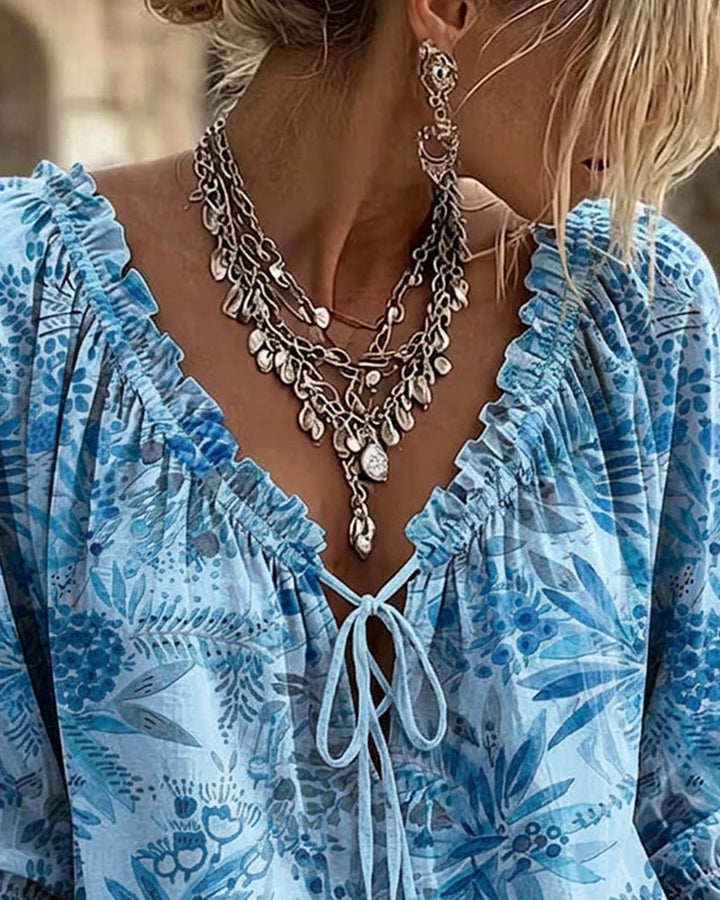 Blusa con escote en V y lazos