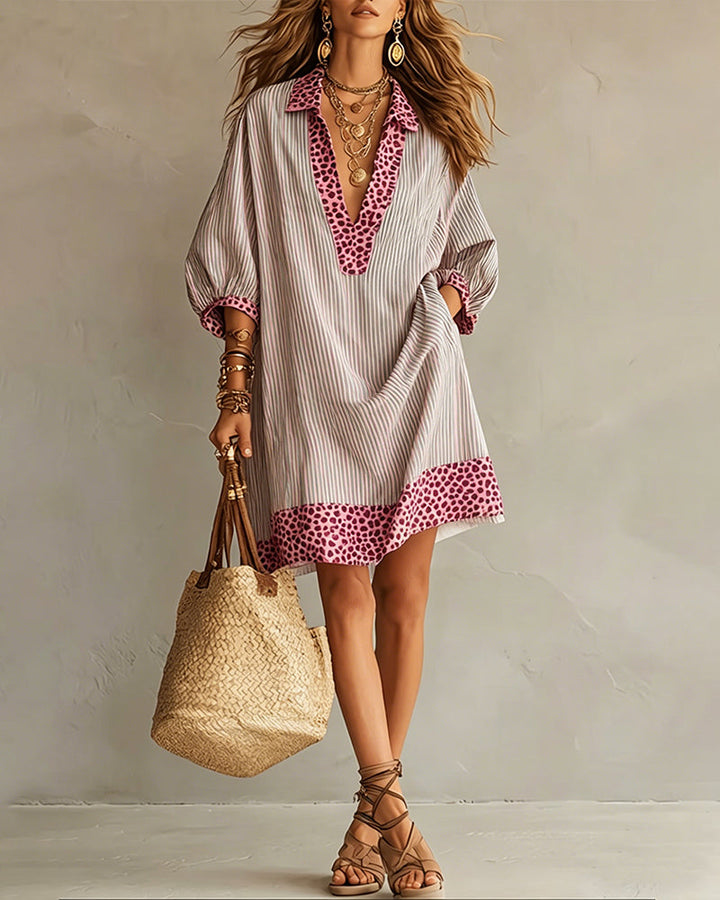 Vestido con paneles estampados de leopardo, mangas abullonadas y camisa a rayas.