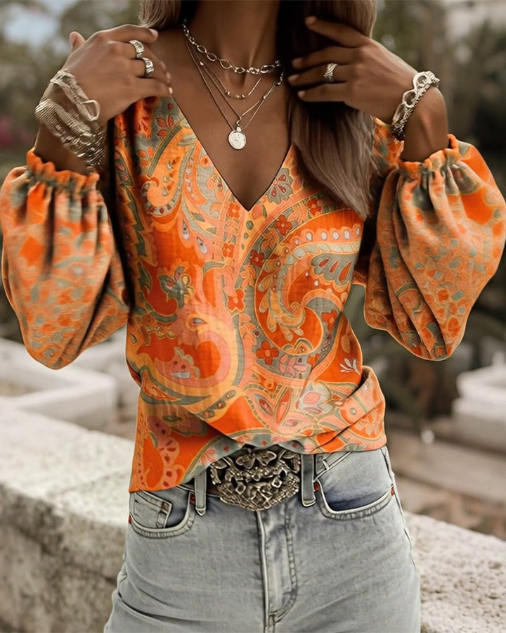 Blusa estampada con escote en V y mangas abullonadas