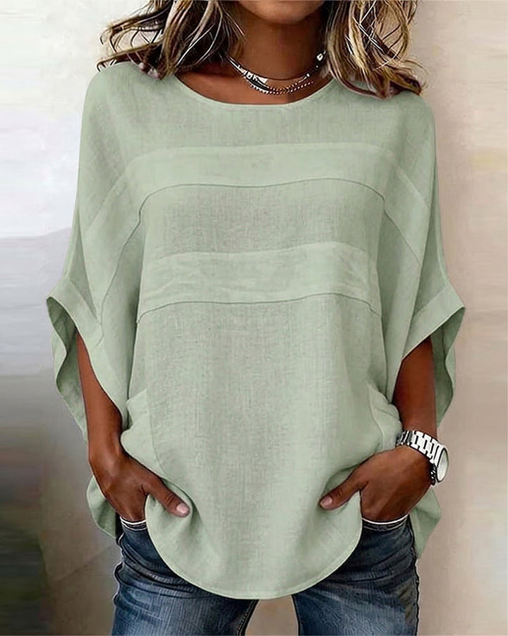 Blusa 100% algodón, mangas murciélago, corte holgado, cuello redondo