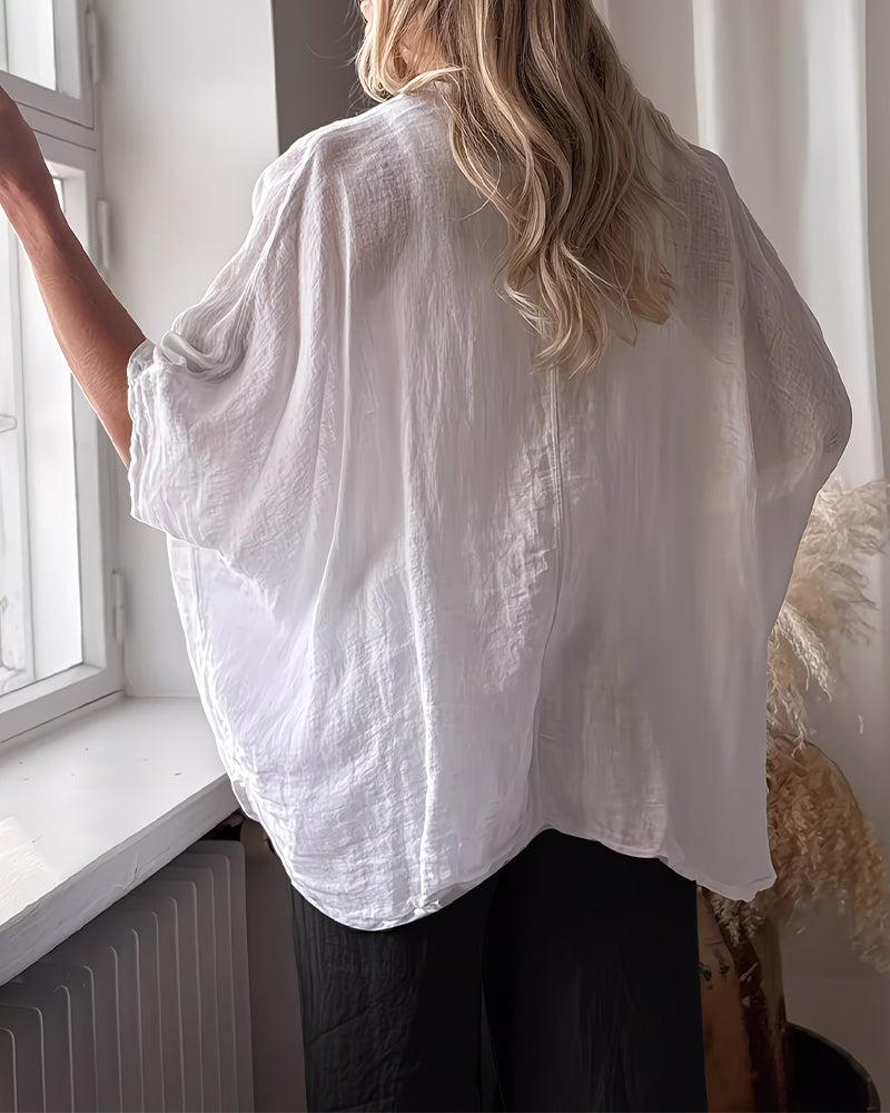 Blusa holgada de manga murciélago, color sólido