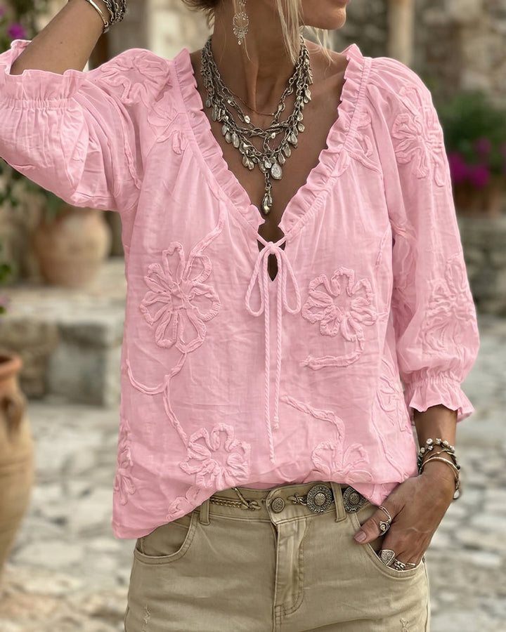 Blusa de algodón 100%, escote en V envolvente, con lazo y volantes