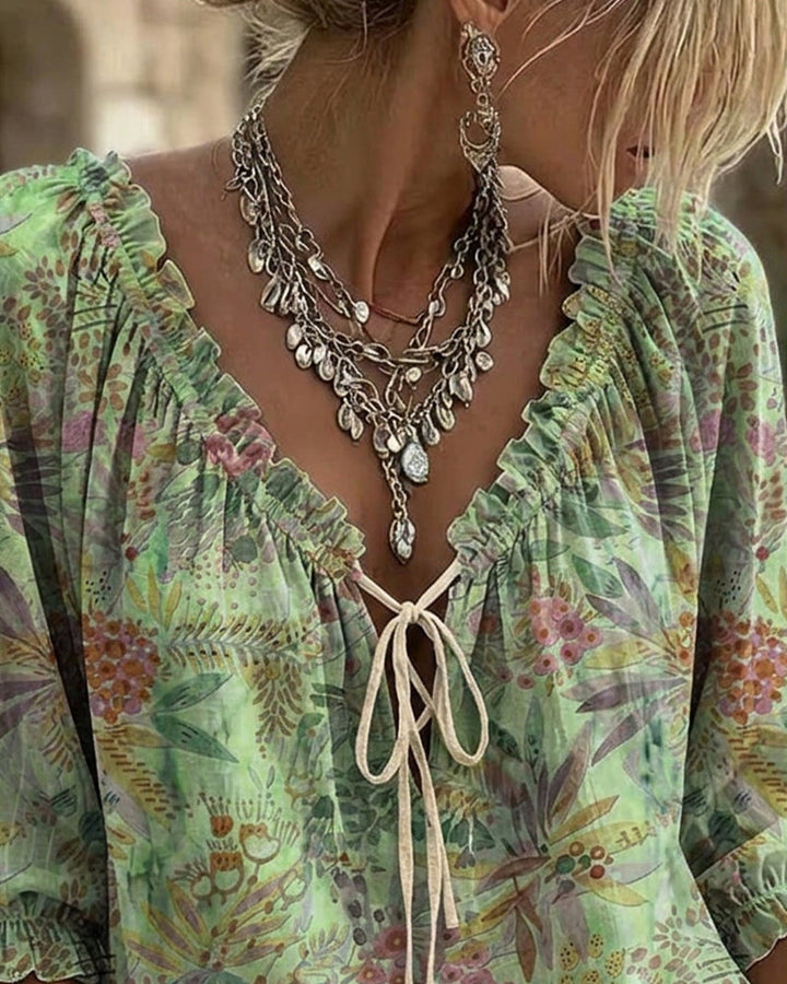 Blusa con escote en V y lazos