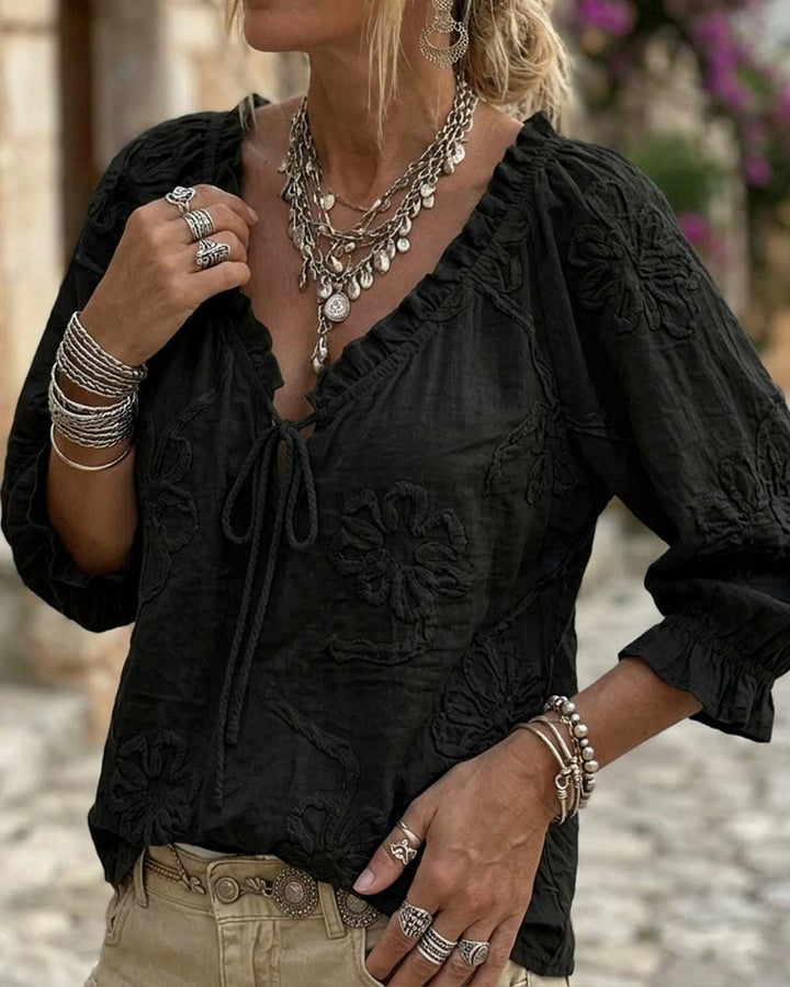 Blusa de algodón 100%, escote en V envolvente, con lazo y volantes