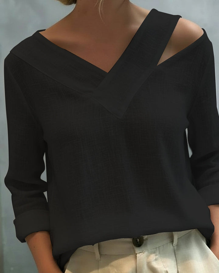 Top elegante con escote en V y tirante caído