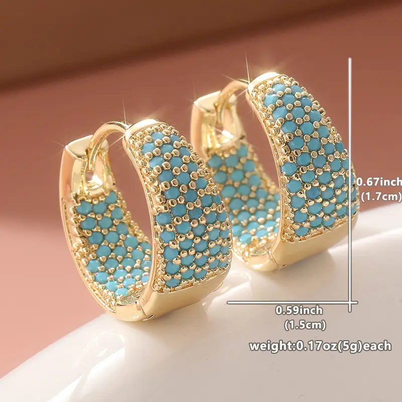 Elegantes aros de oro con perlas turquesas