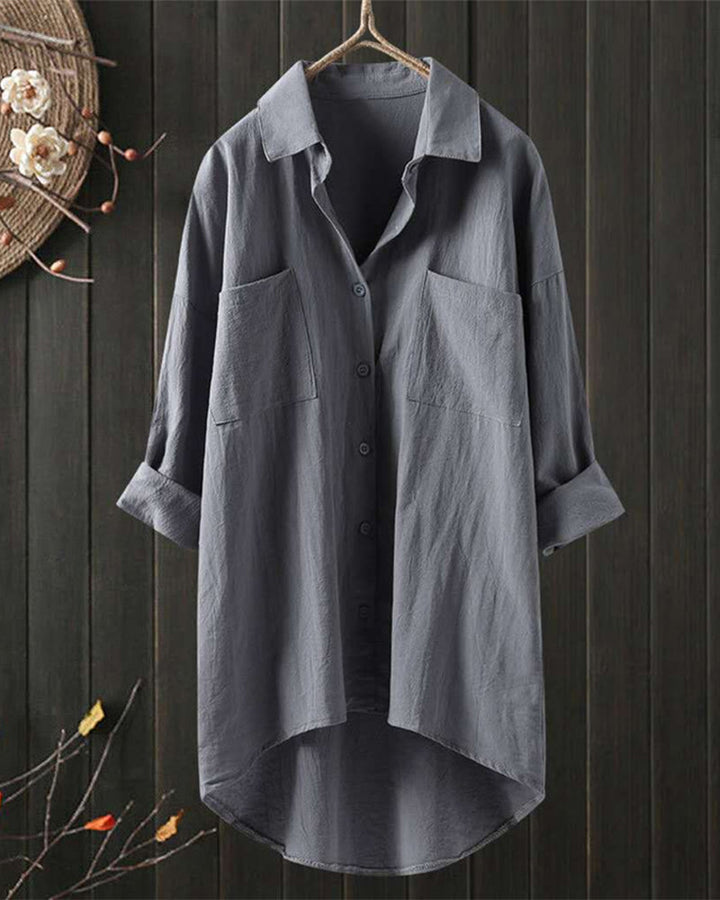 Blusa amplia de color sólido con mangas largas