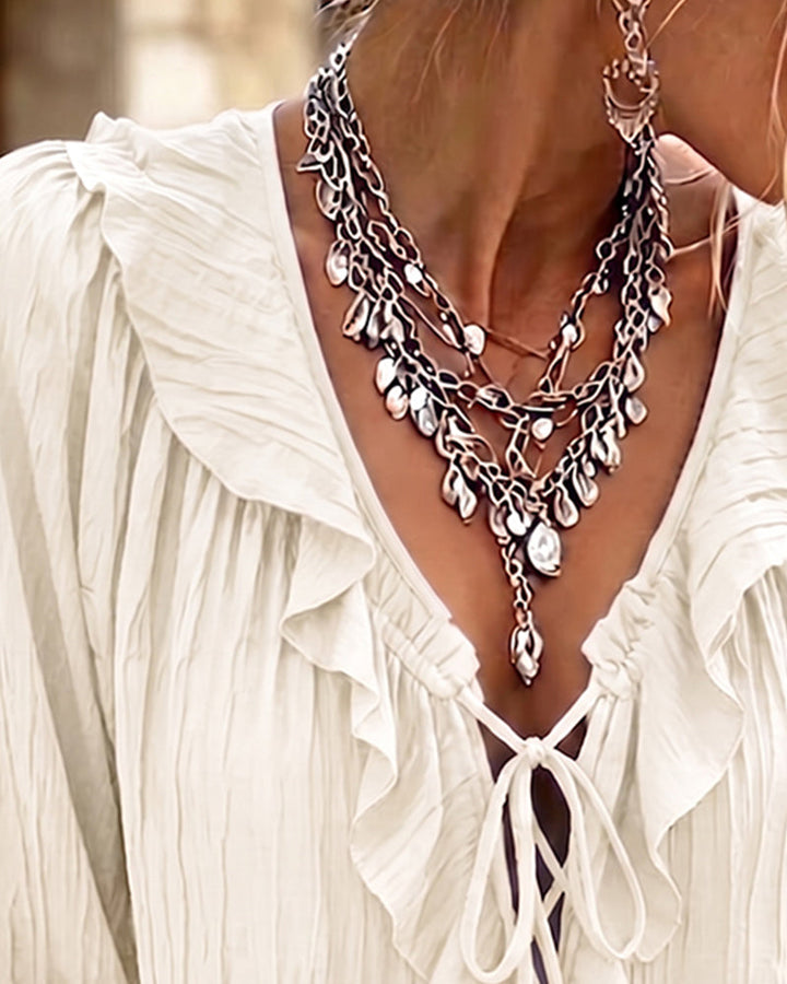 Blusa de manga larga con volante y ribete de encaje