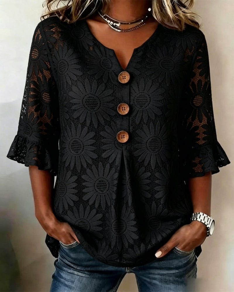 Blusa con estampado de margaritas y mangas con volantes