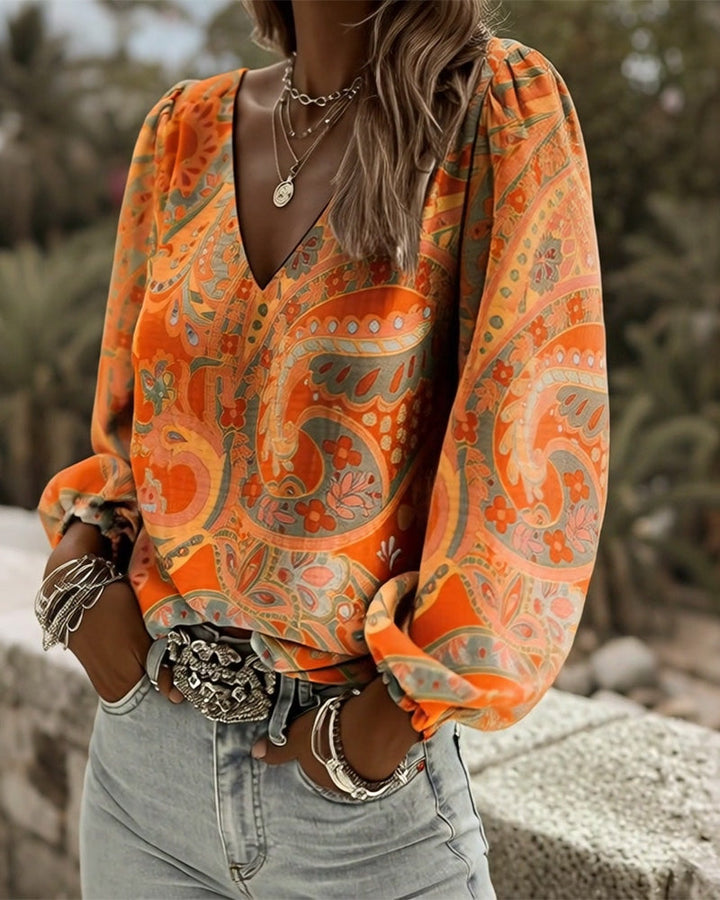 Blusa estampada con escote en V y mangas abullonadas