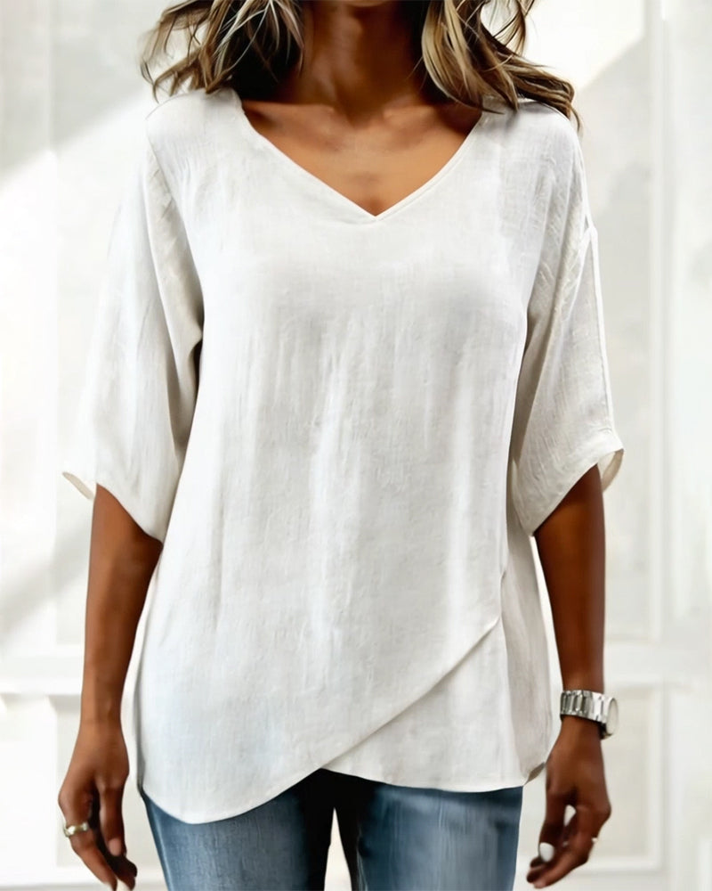 Top con dobladillo irregular, color liso, cuello en V