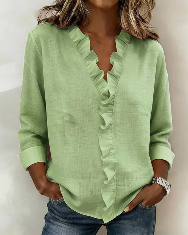 Blusa de manga larga con volantes y escote en V