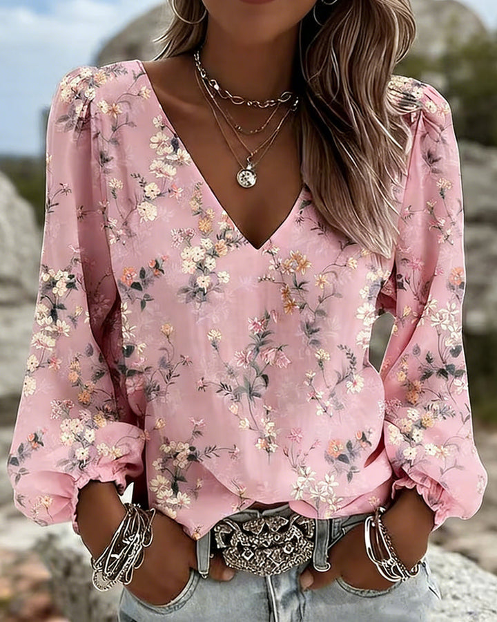 Blusa floral con cuello en V y mangas abullonadas