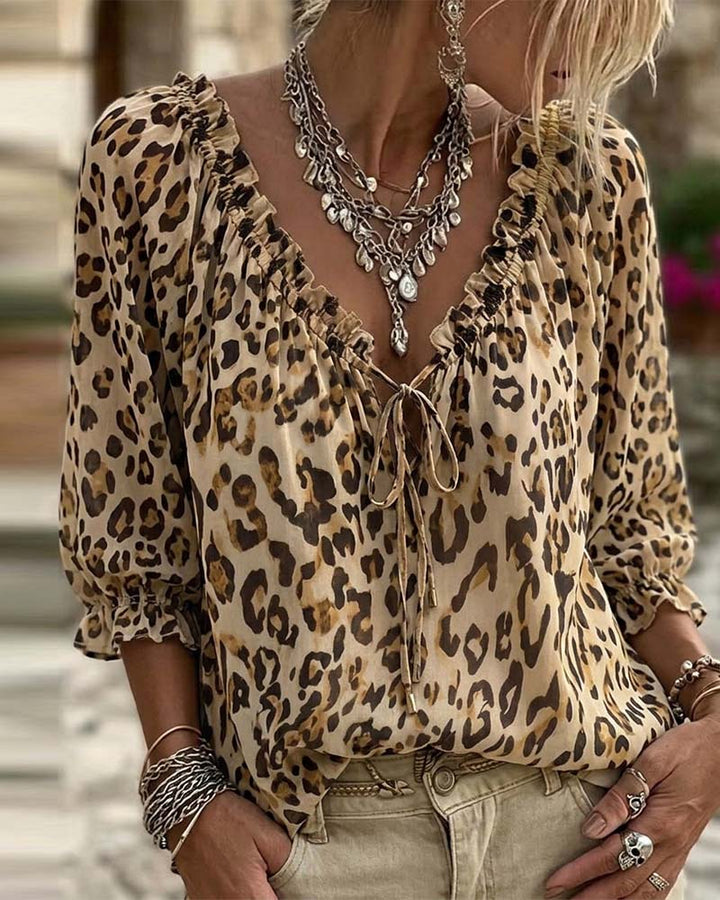 Blusa estampada de leopardo cuello en V mangas abullonadas con lazos
