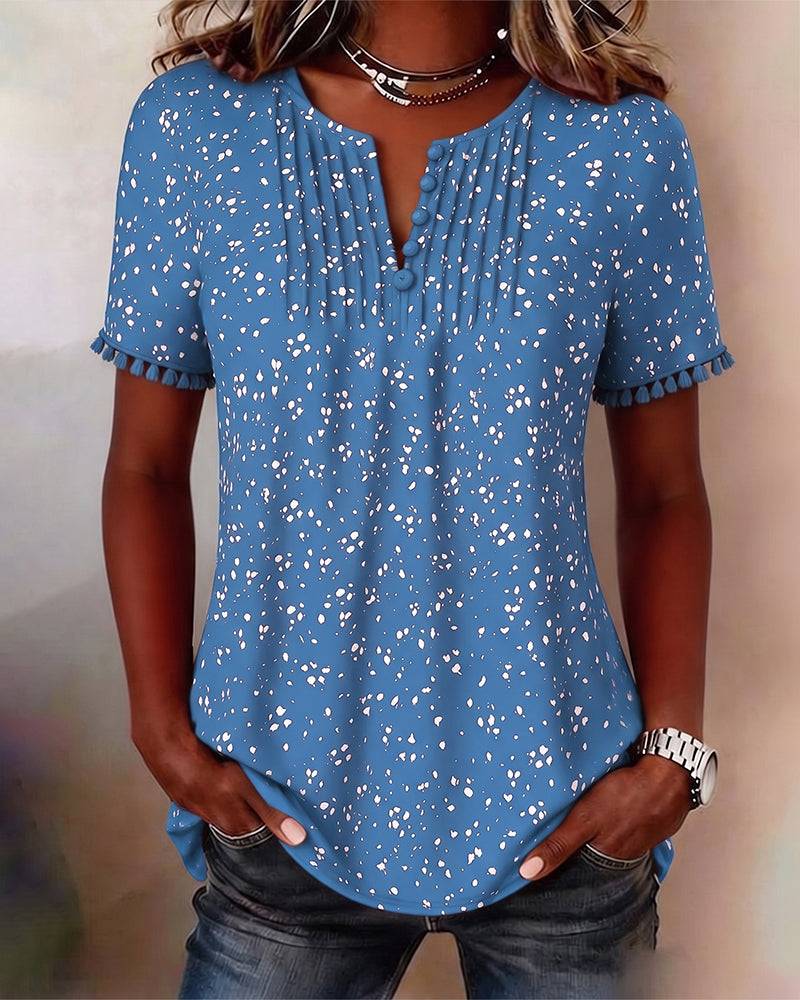 Blusa blanca de punto con flecos y mangas cortas