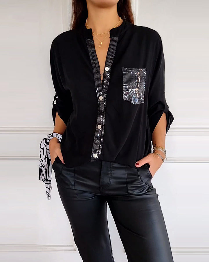 Top casual con paneles y botones con lentejuelas