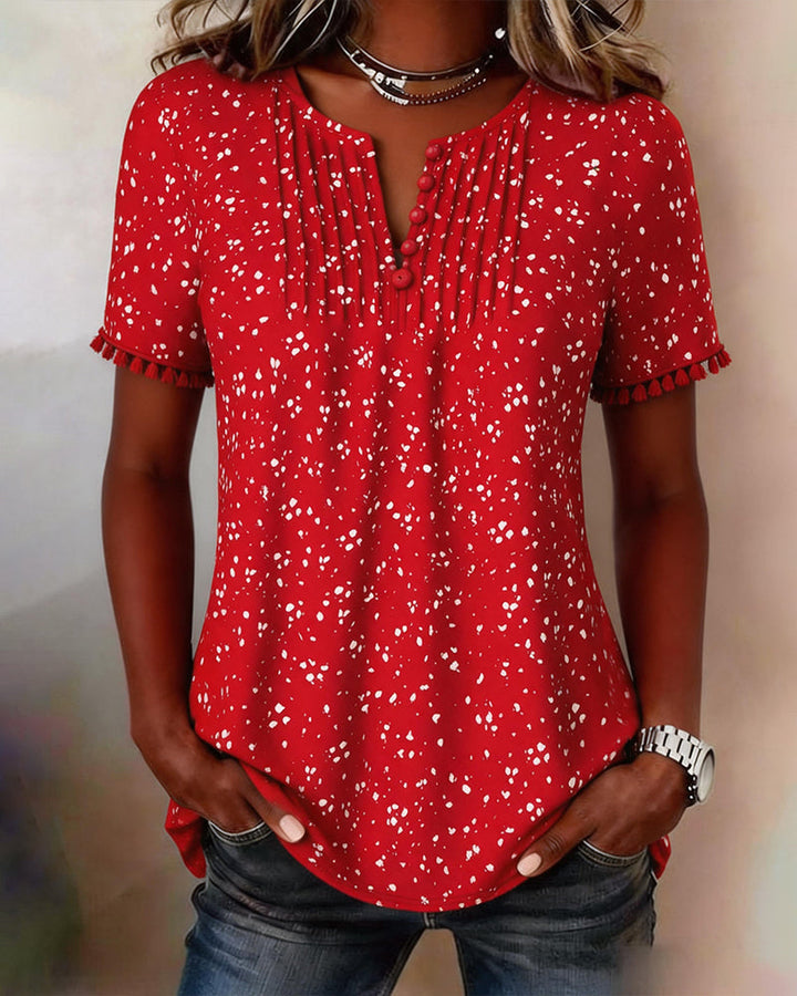 Blusa blanca de punto con flecos y mangas cortas