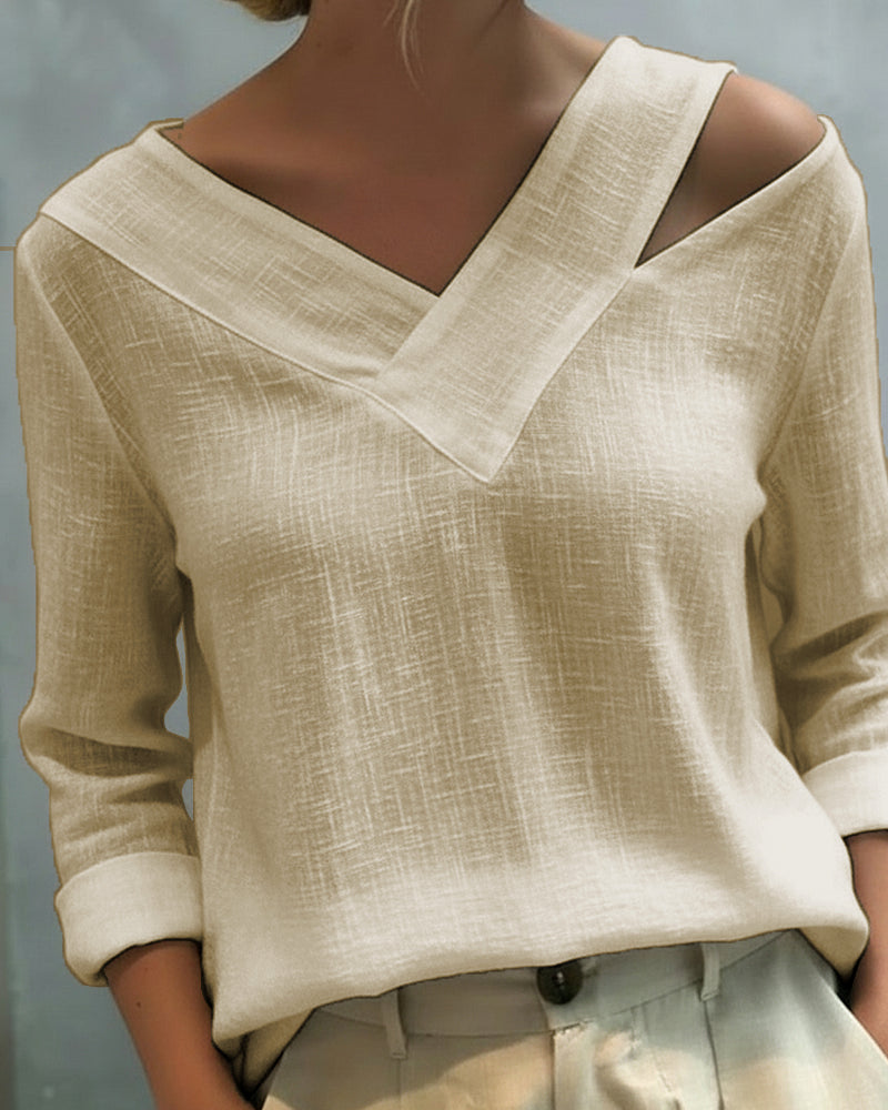 Top elegante con escote en V y tirante caído