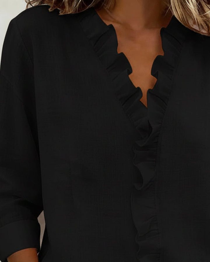 Blusa de manga larga con volantes y escote en V