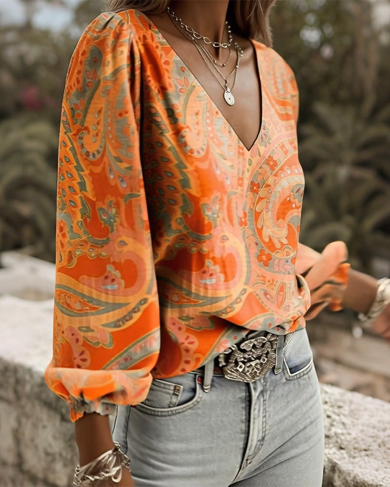 Blusa estampada con escote en V y mangas abullonadas