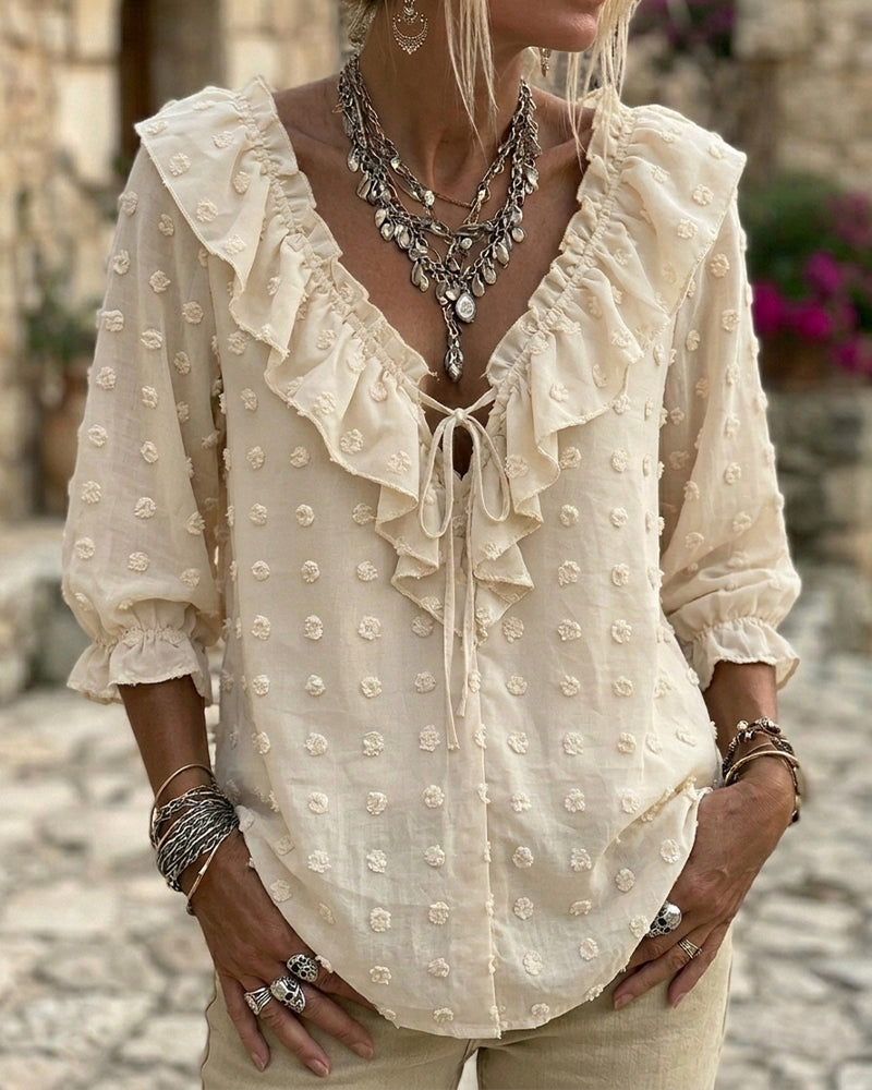 Blusa de jacquard con lunares y mangas globo, escote en V
