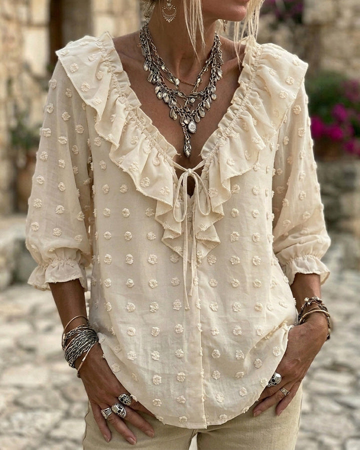 Blusa de jacquard con lunares y mangas globo, escote en V