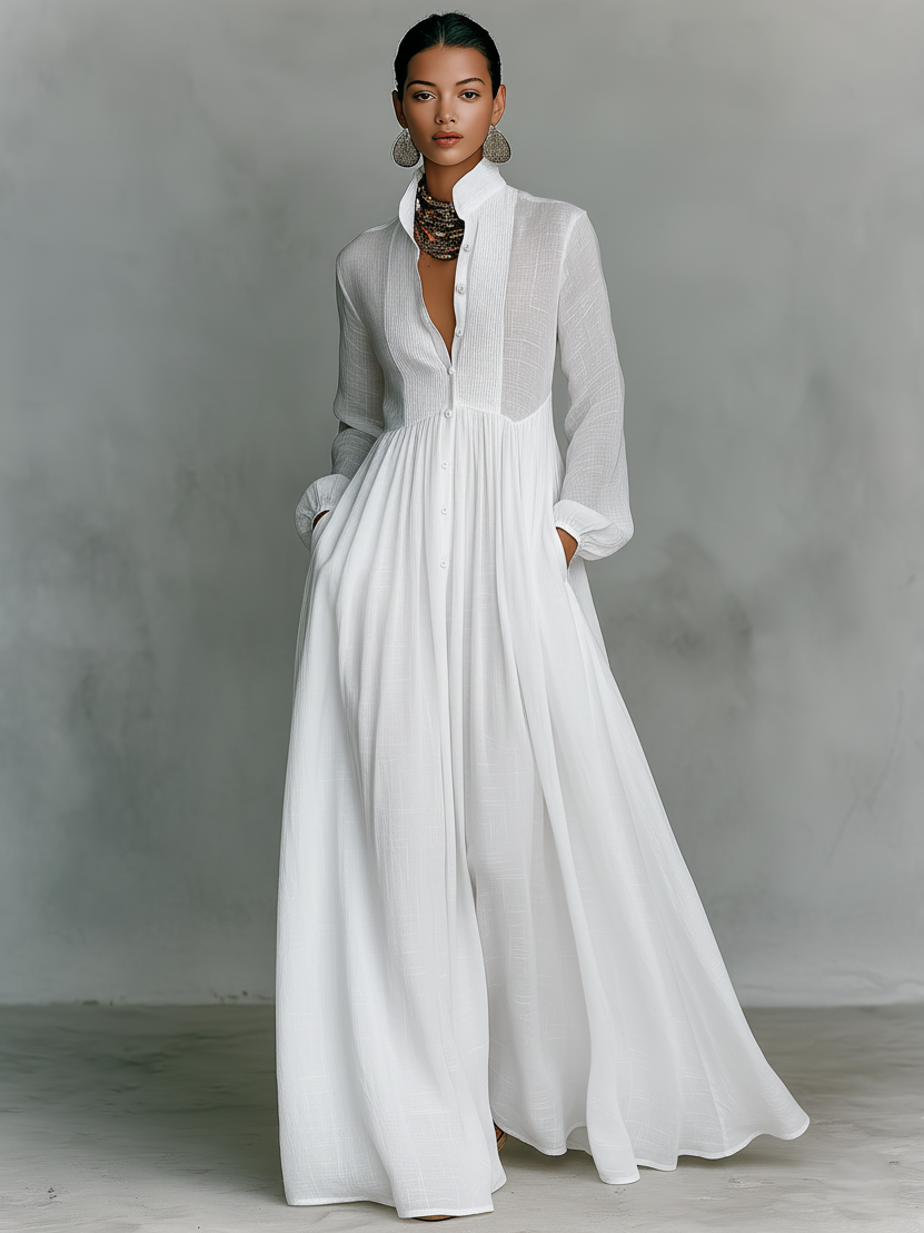 Vestido maxi minimalista en algodón y lino con patchwork, cuello alto y mangas largas