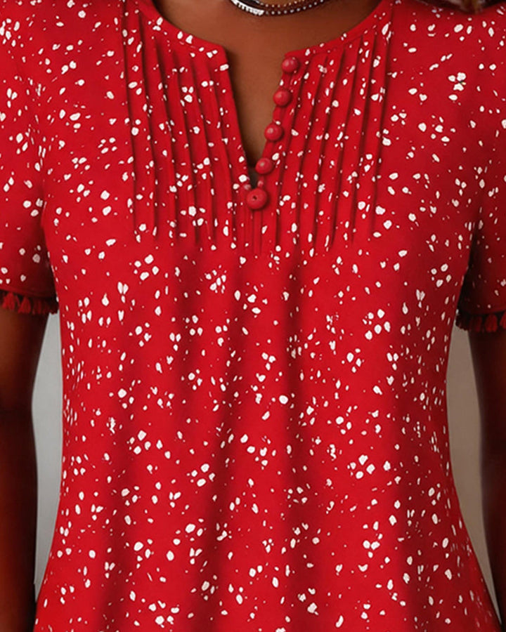 Blusa blanca de punto con flecos y mangas cortas